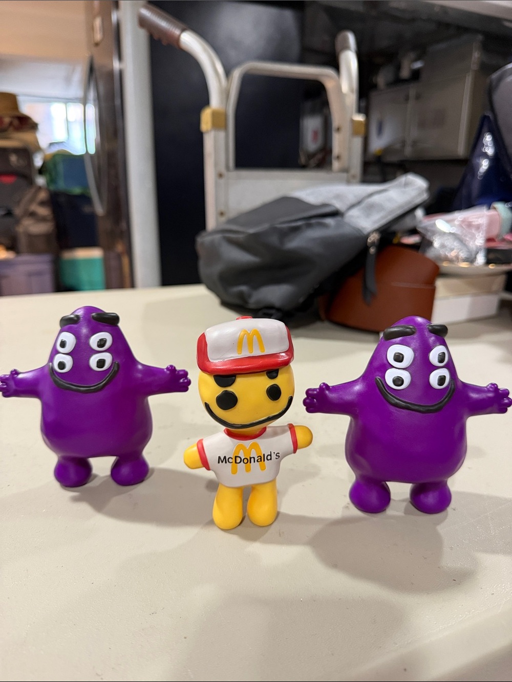 McDonald's Yellow Crew Character with Two Purple Grimace Figures